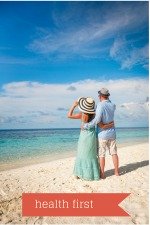 Two people at the beach putting their health first.